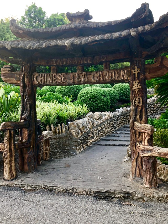 Oriental wooden sign reading "Chinese Tea Garden".