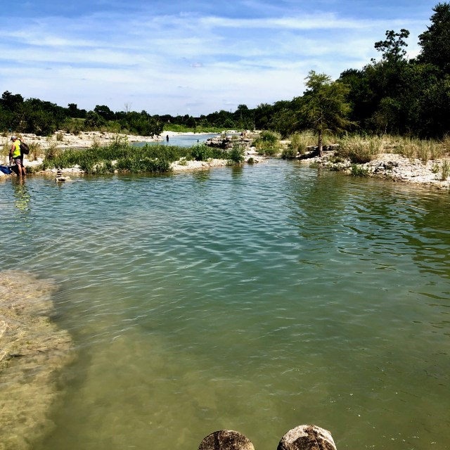 River stretches to the horizon.